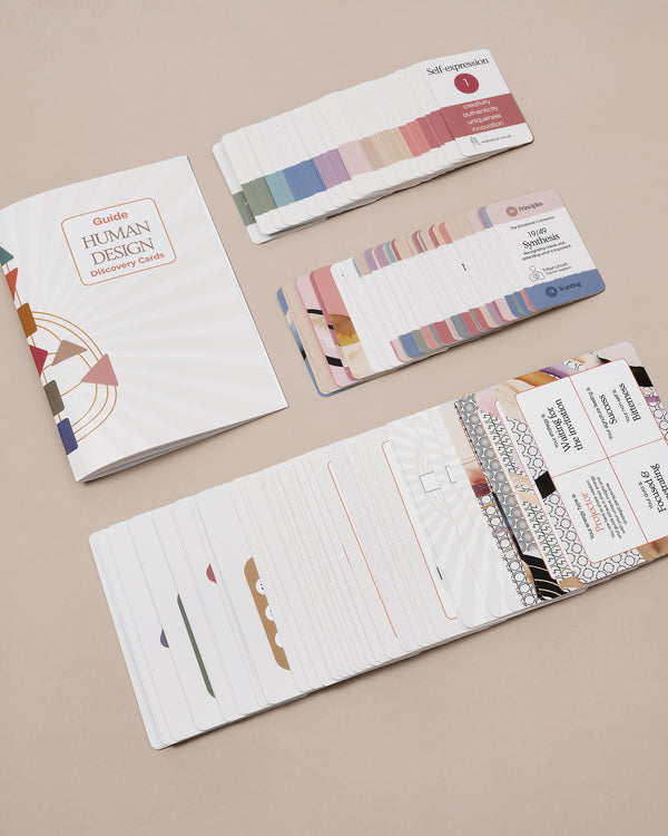 Close-up of Human Design cards showing gates and centres